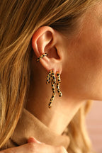 Paire de boucles d'oreilles Léopard asymétriques dorées
