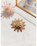Broche soleil doré