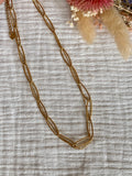 Collier double ras de cou, mailles larges striées
