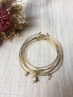 Semainier fin acier doré (7 bracelets), soleil et pierres