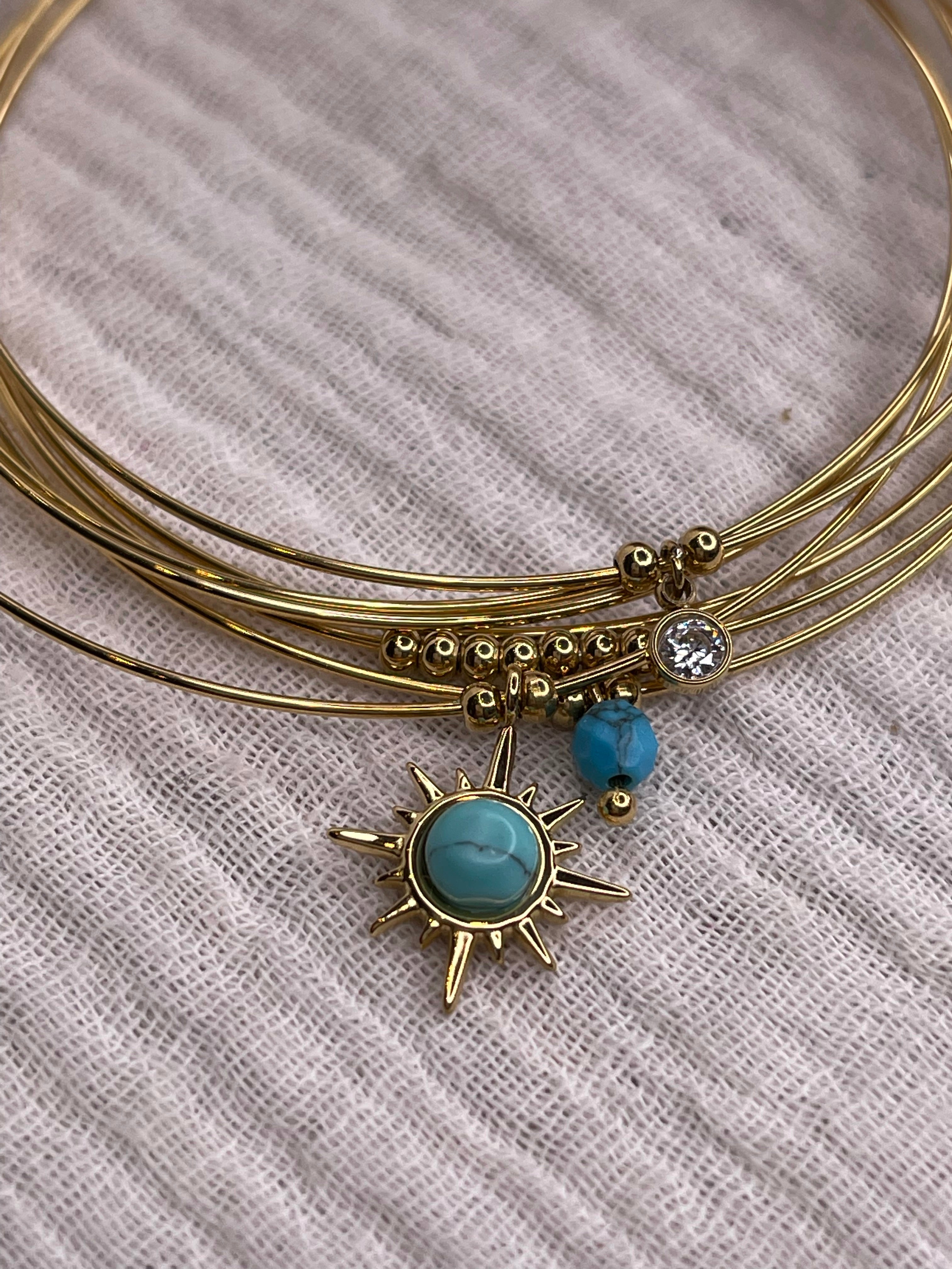 Semainier fin acier doré (7 bracelets), soleil et pierres