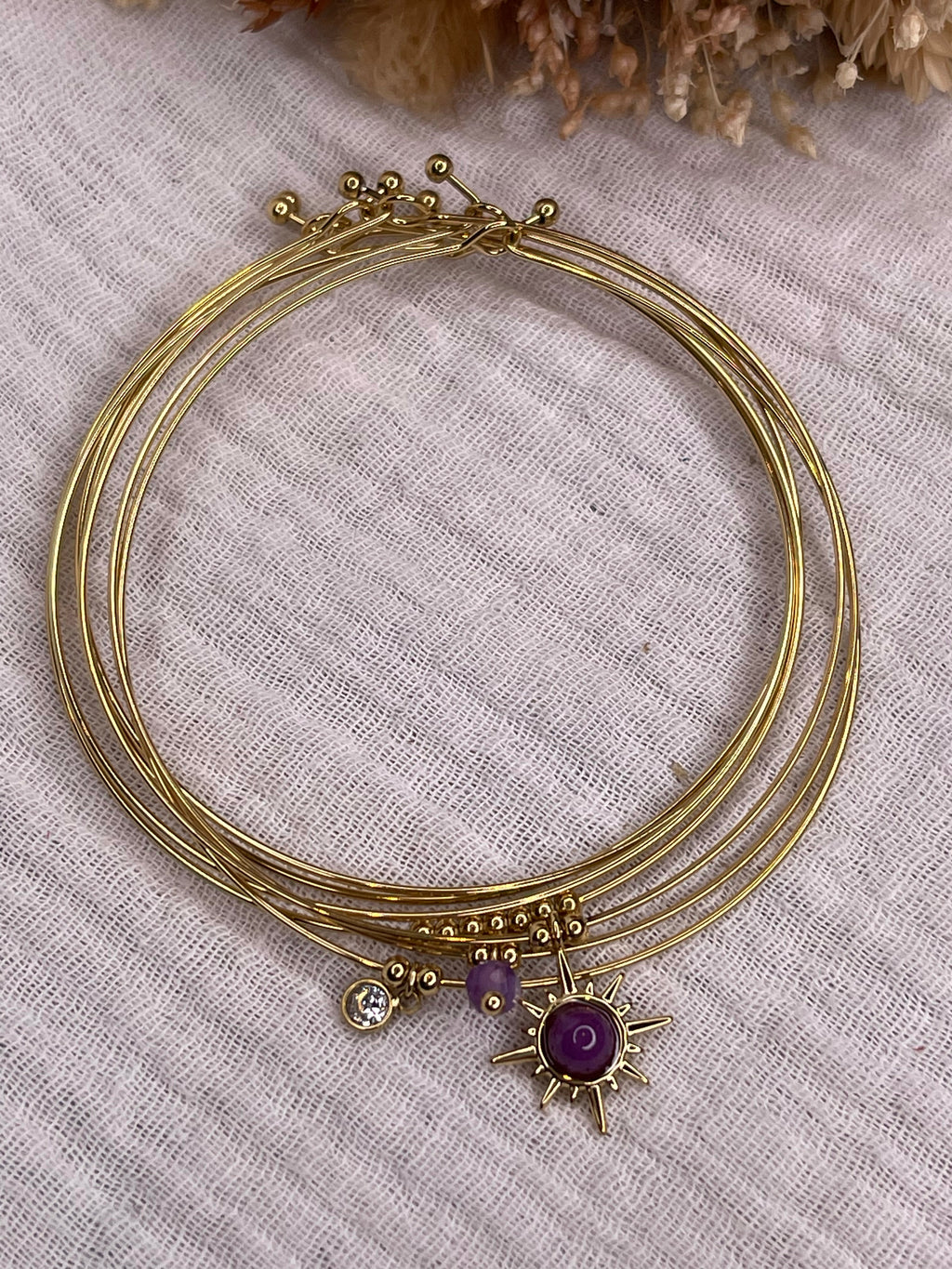 Semainier fin acier doré (7 bracelets), soleil et pierres