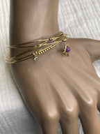Semainier fin acier doré (7 bracelets), soleil et pierres