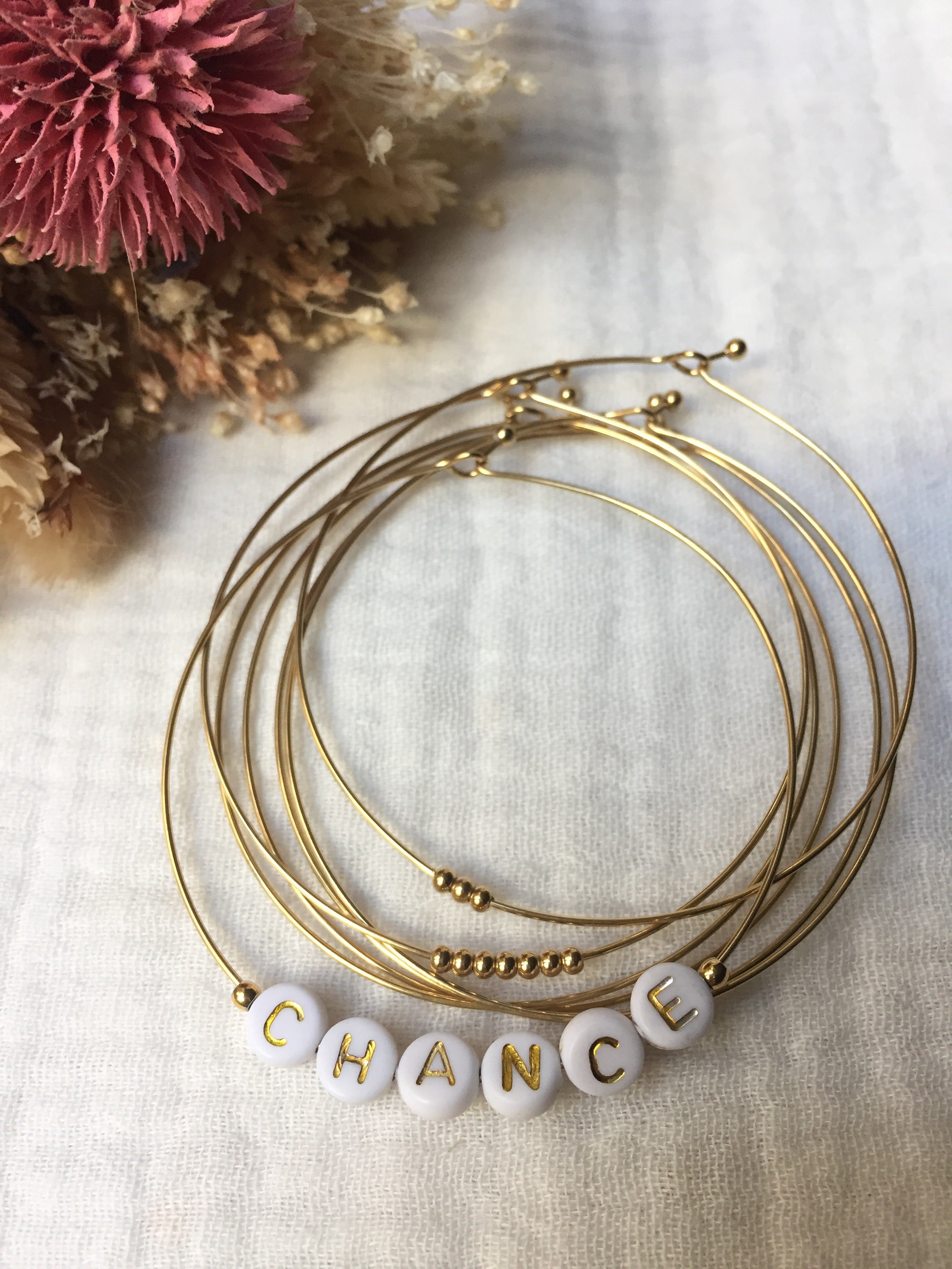 Semainier fin acier doré (7 bracelets), CHANCE