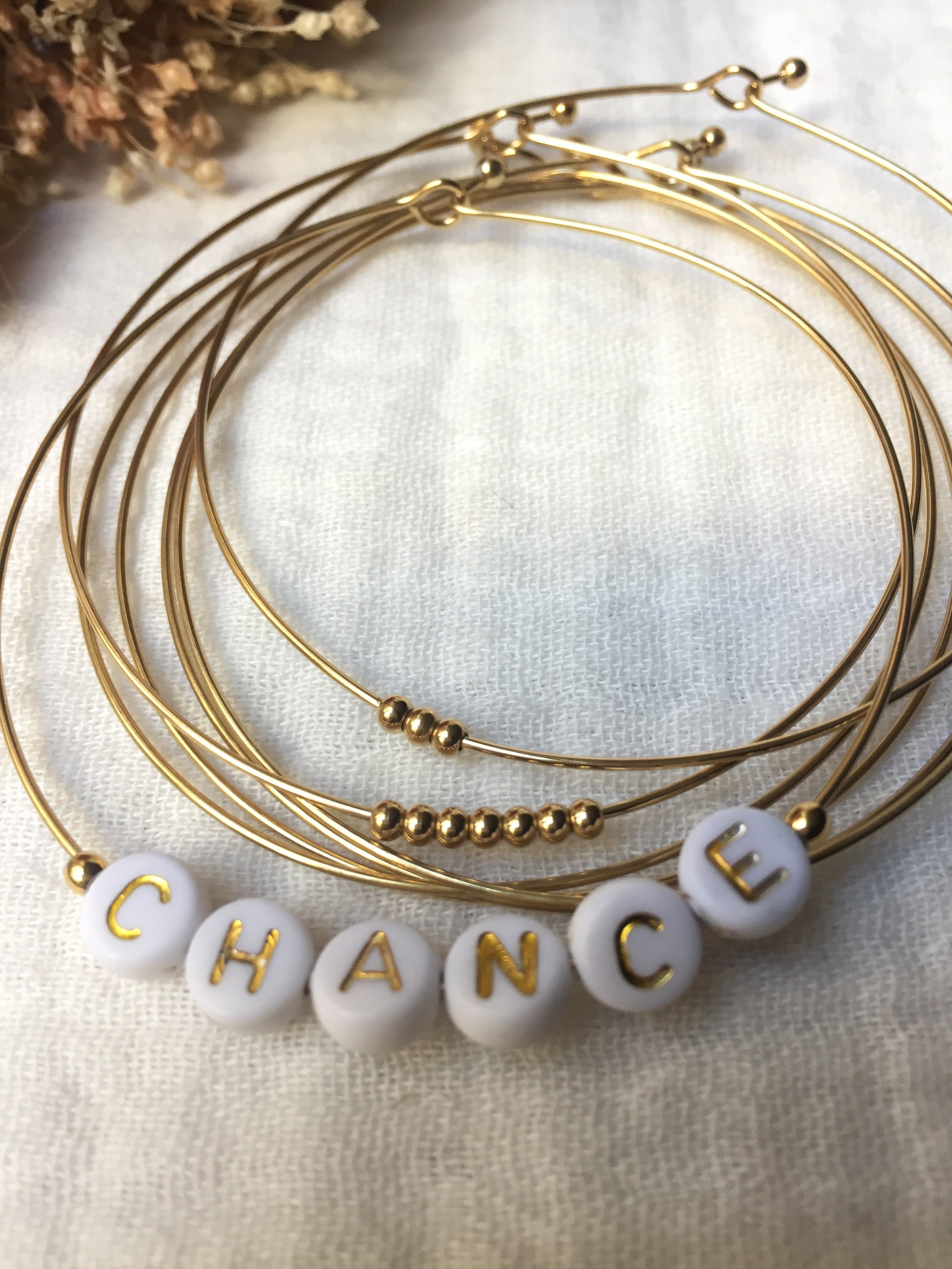Semainier fin acier doré (7 bracelets), CHANCE